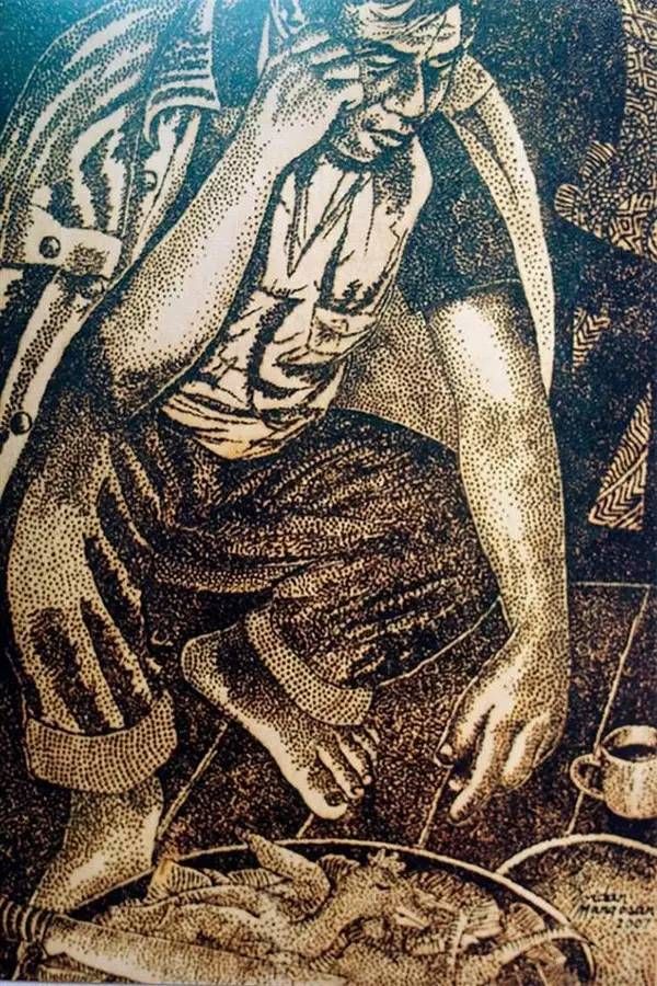 艺术家在太阳下用放大镜画画