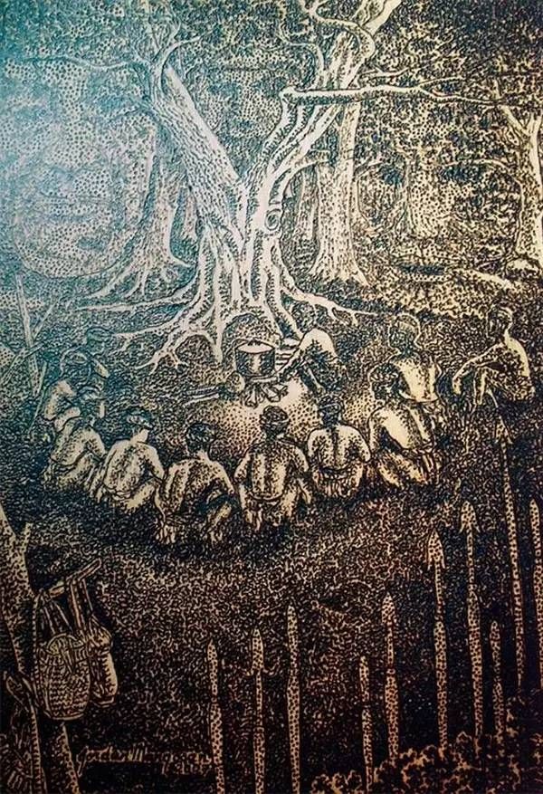 艺术家在太阳下用放大镜画画