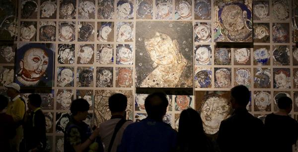   正在中华艺术宫展出的“丝路精魂——丁和古代龟兹石窟壁画艺术纪实”展