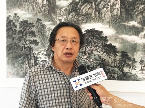 张雄艺术网采访中国少数民族美术促进会展览部主任梁义勇